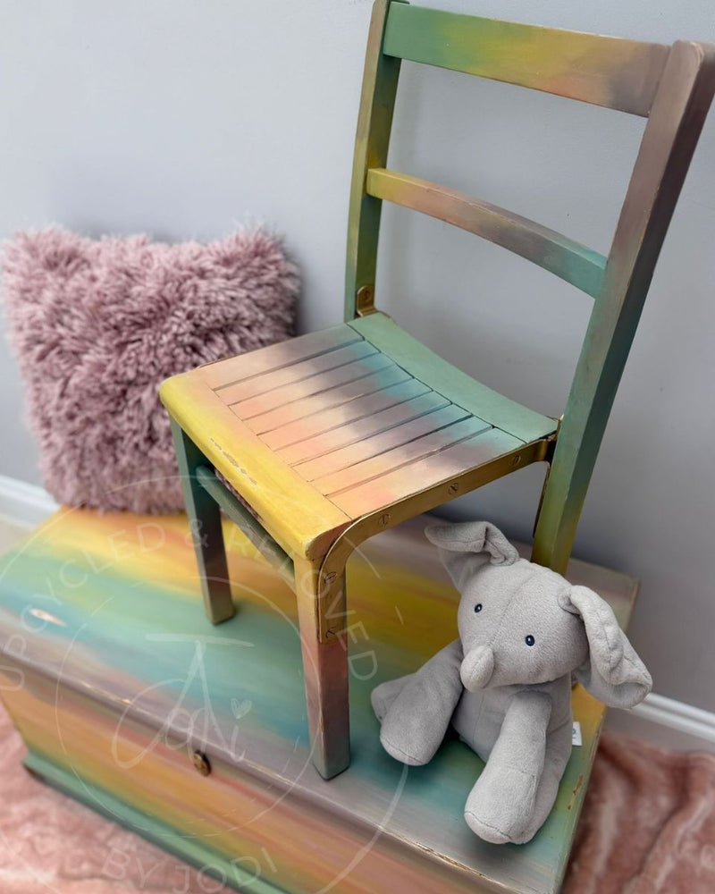 Upcycled children’s toy chest and chair painted in an ombre effect in soft pastel Fusion Mineral Paint shades.