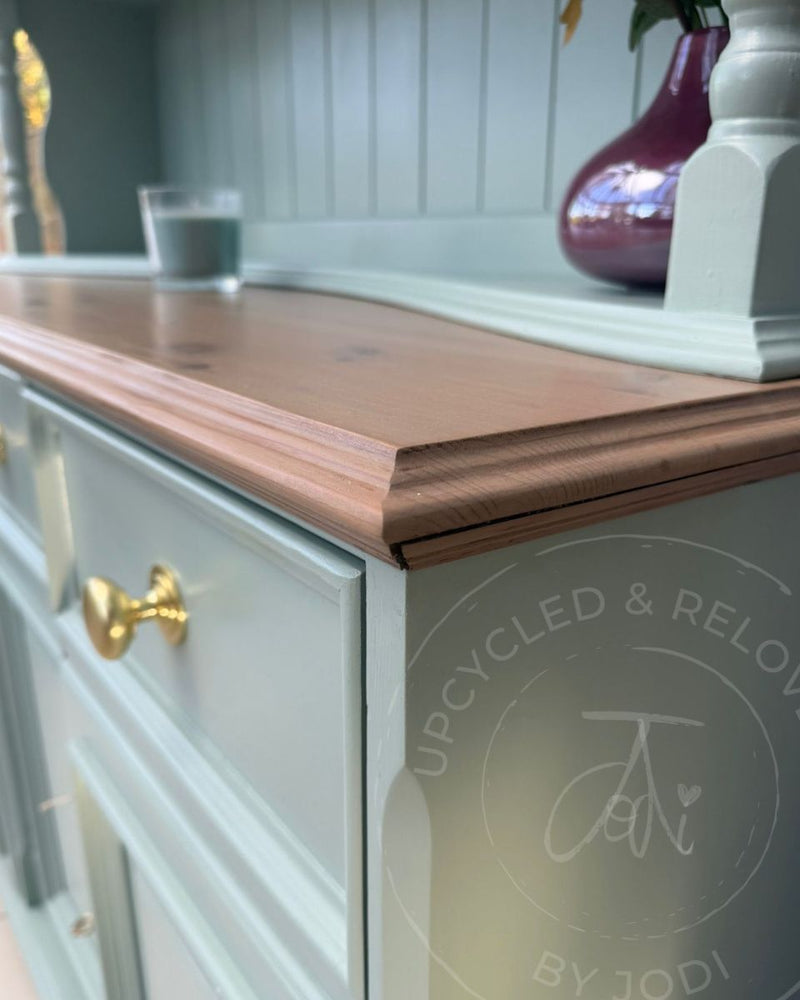 Close up of washed wood top on a Welsh dresser upcycled by Upcycled & Reloved by Jodi in soft blue-green Fusion Mineral Paint Inglenook.