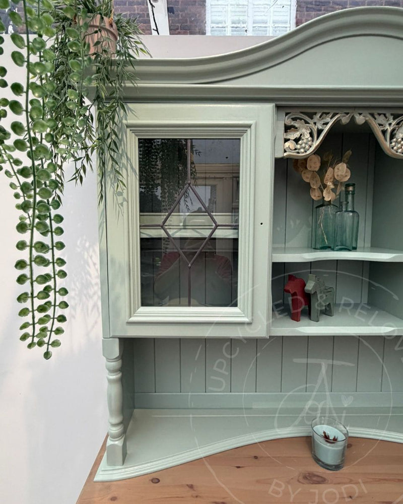 Welsh dresser upcycled by Upcycled & Reloved by Jodi in soft blue-green Fusion Mineral Paint Inglenook with a washed wood top and gold gilding on carved grape details.