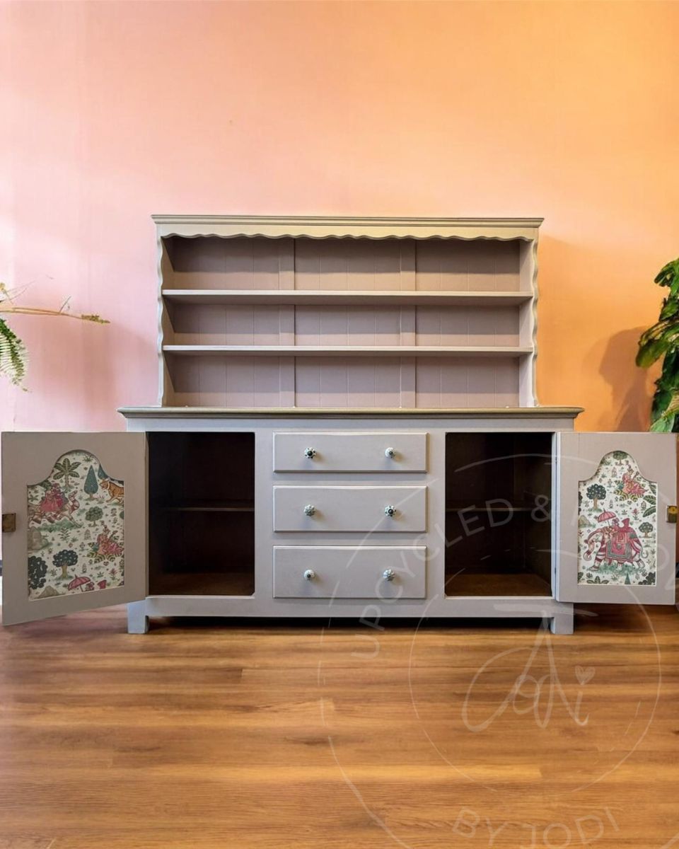 Whimsical Welsh dresser upcycled in Fusion Alchemy Sandstone with dusky pink Fusion Mineral Paint Damask showing Indian-inspired wallpaper decoupage on the inside of the doors