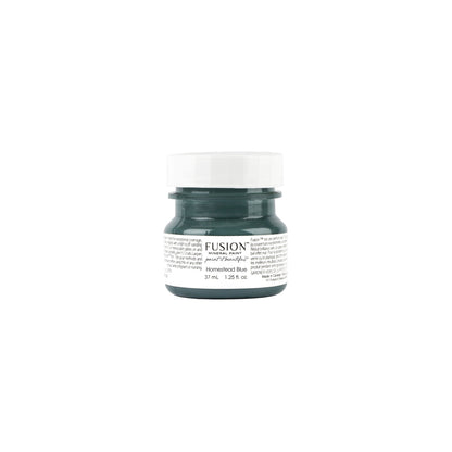Tester-sized jar of Fusion Mineral Paint in Homestead Blue on a white background.